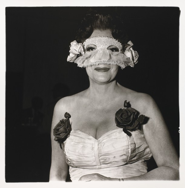 Lady at a masked ball with two roses on her dress, N.Y.C.