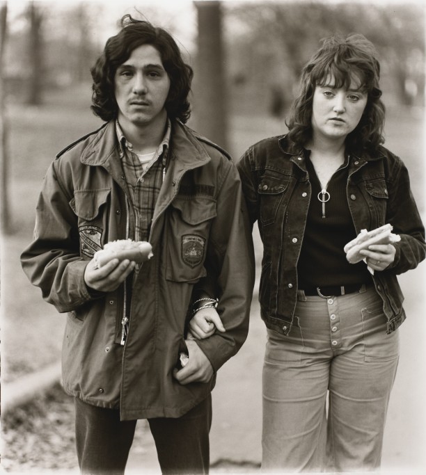 A young man and his girlfriend with hot dogs in the park, N.Y.C.