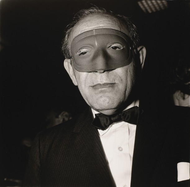 Masked man at a ball, N.Y.C.