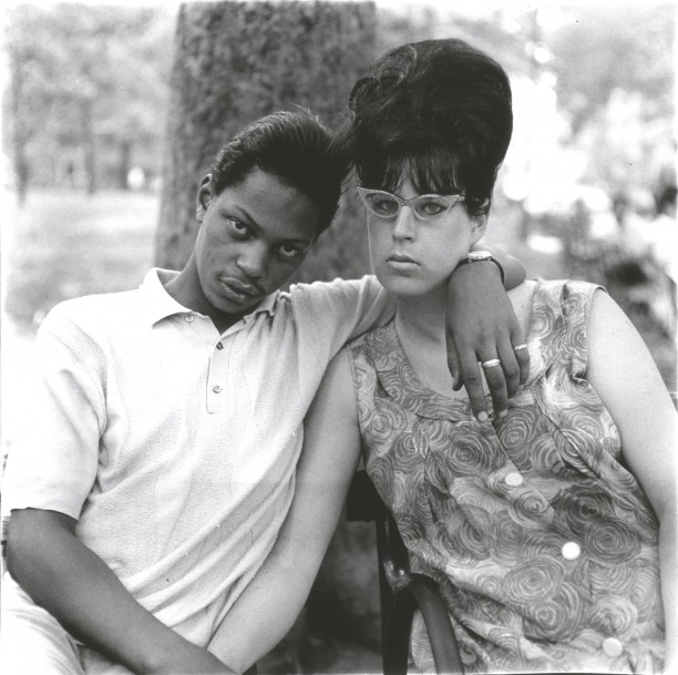 A young man and his pregnant wife in Washington Square Park, N.Y.C.
