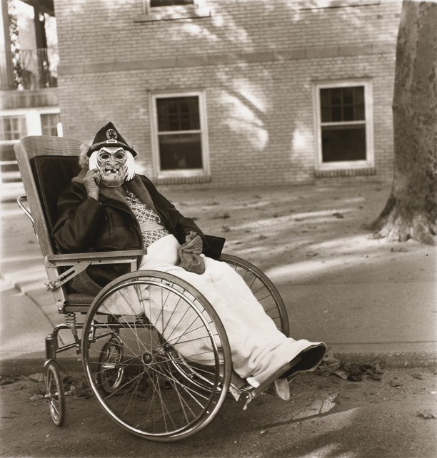Masked woman in a wheelchair, Pa.