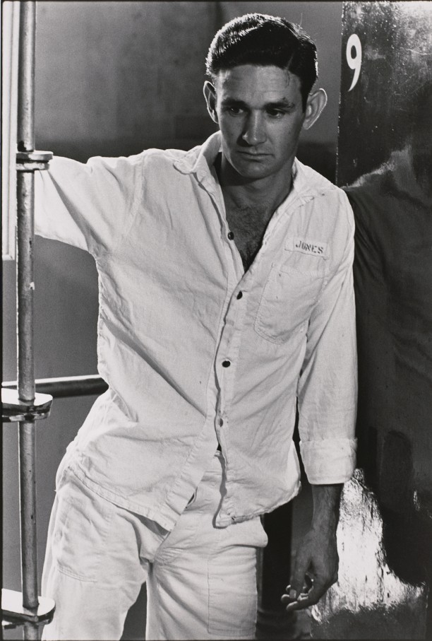 Untitled (Inmate in white shirt, number 9 on adjacent wall)