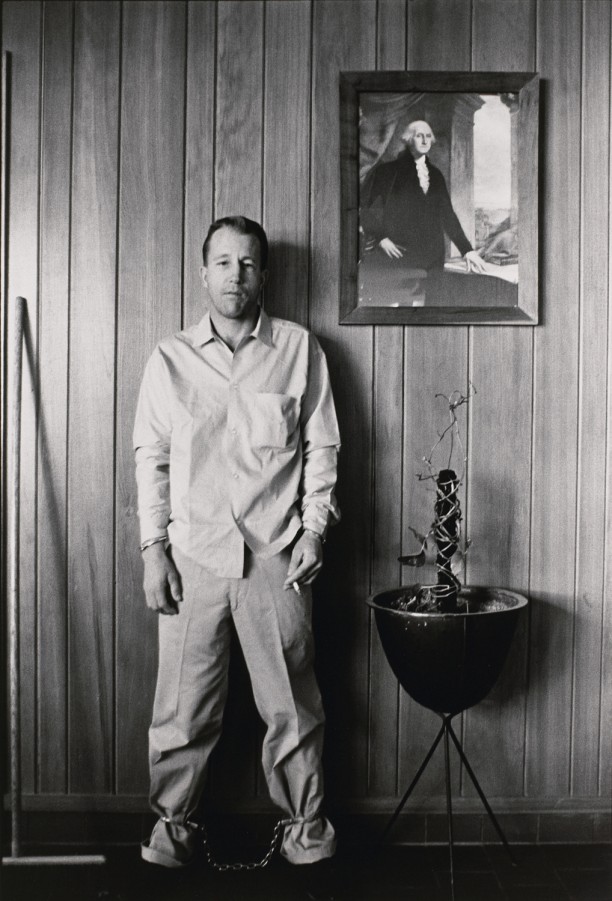 Inmate outside warden's office, about to be transferred by local authorities