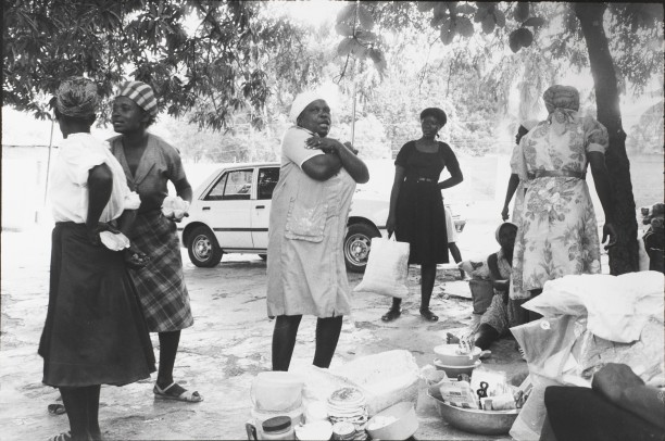 Women that sell food outside the Copa Club reenact the attacks upon the Tontons Macoute