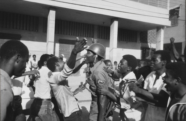 The soldier is greeted as hero. February 7th, Port-au-Prince