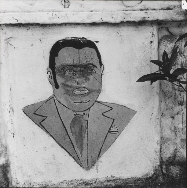 Baby Doc. Defaced mural in Léogâne