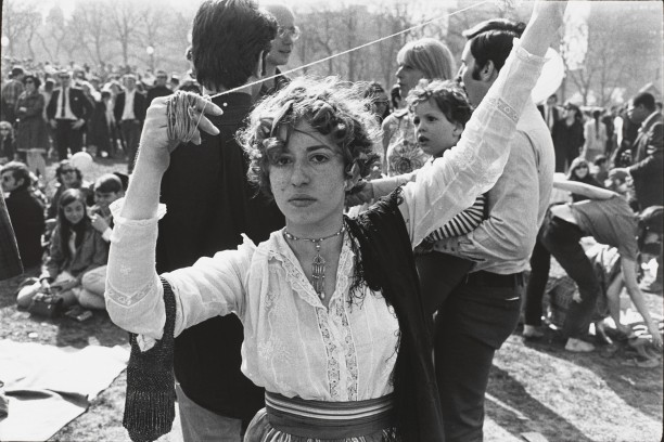 Untitled (Woman in lace blouse, arms raised with twine in her hands)