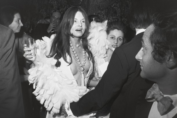 Untitled (Woman in feather trimmed low cut dress)