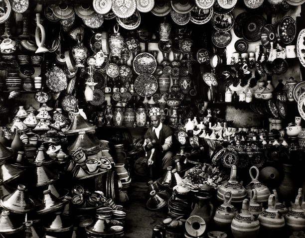 Shopkeeper with Clay Pots in Marrakech